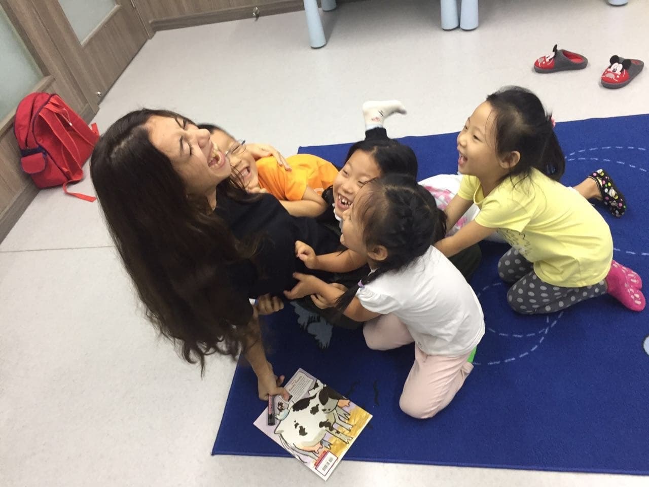Armine laughing with her students